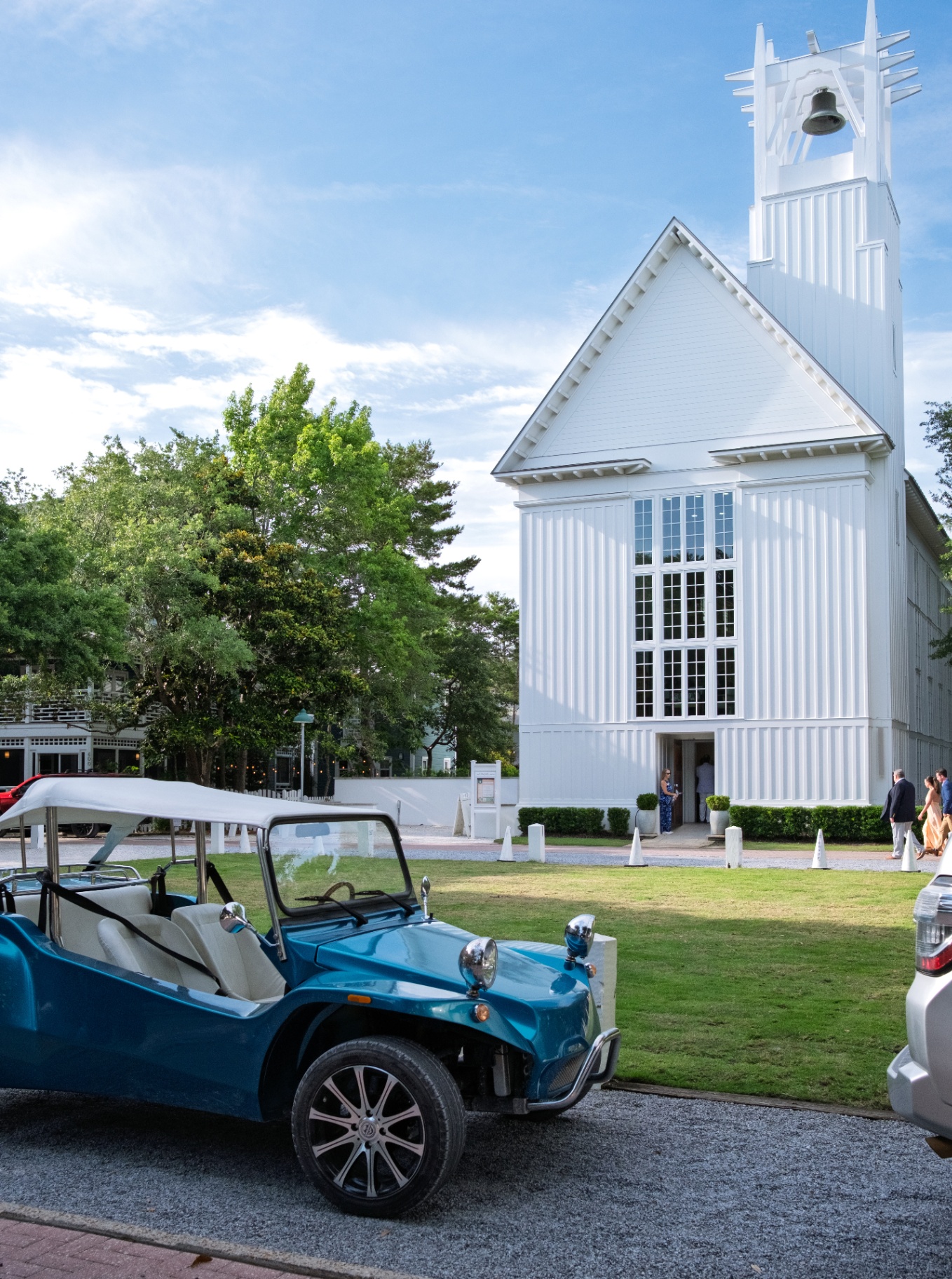 White chapel at Seaside, Florida with a vintage blue dune buggy